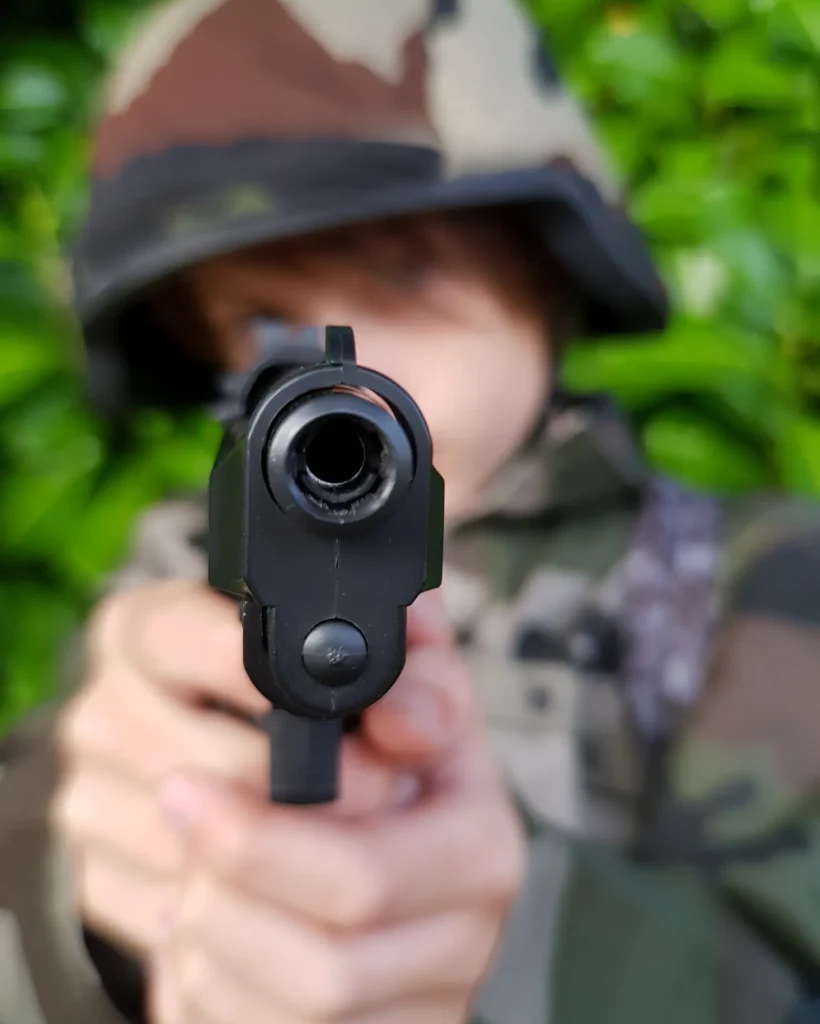 close-up-army-soldier-aiming-with-gun (1)